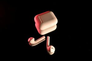 Modern wireless earbuds on a clean surface showing premium design and build quality