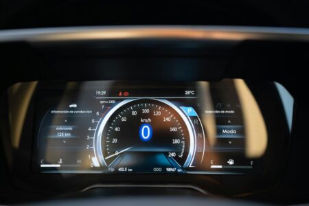 12 Best Smart Car Accessories with OBD-II Integration and Voice Commands Modern car dashboard with digital displays and diagnostic port connector