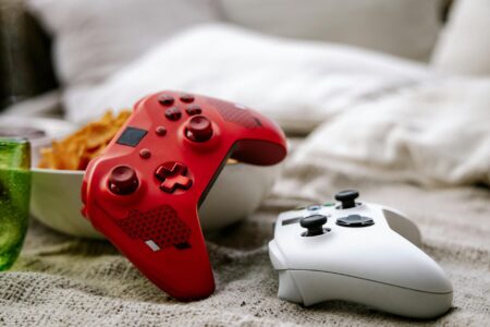 Gaming controller on dark surface representing handheld gaming devices