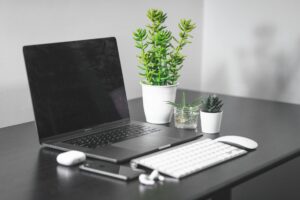 Modern laptop computer on office desk setup for remote work