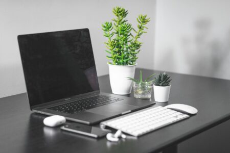 Modern laptop computer on office desk setup for remote work