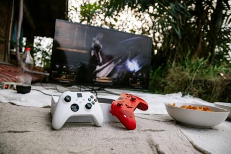 Modern gaming console connected to large display in entertainment center