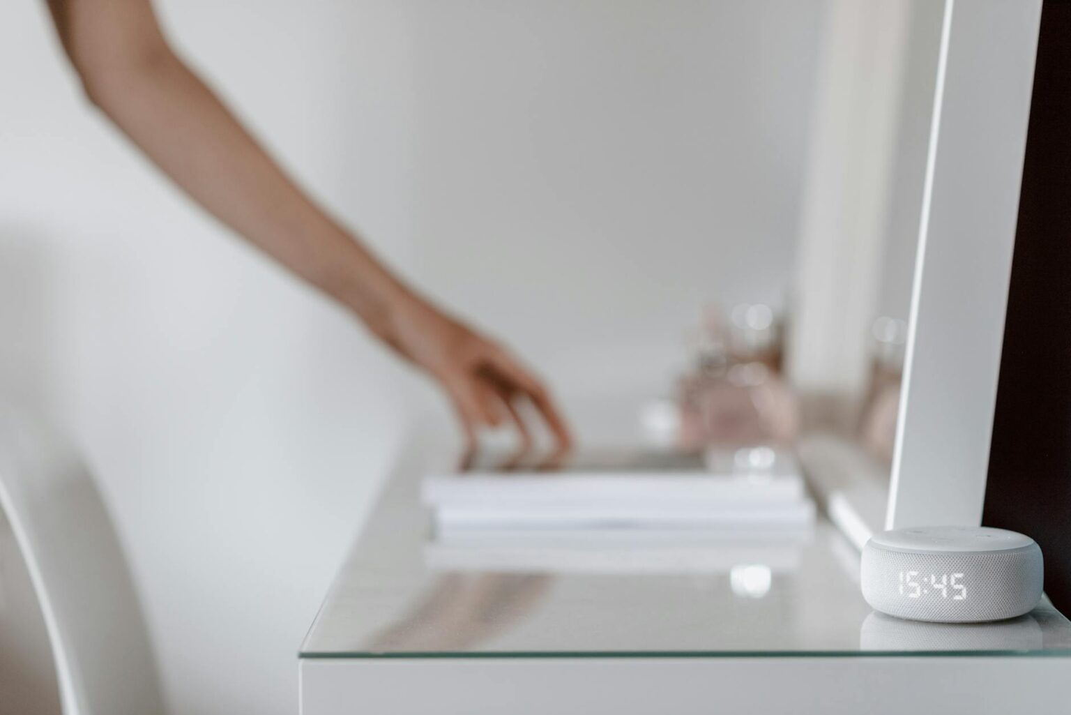 Modern smart mirror displaying fitness interface in contemporary home setting