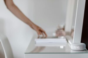 Modern smart mirror displaying fitness interface in contemporary home setting