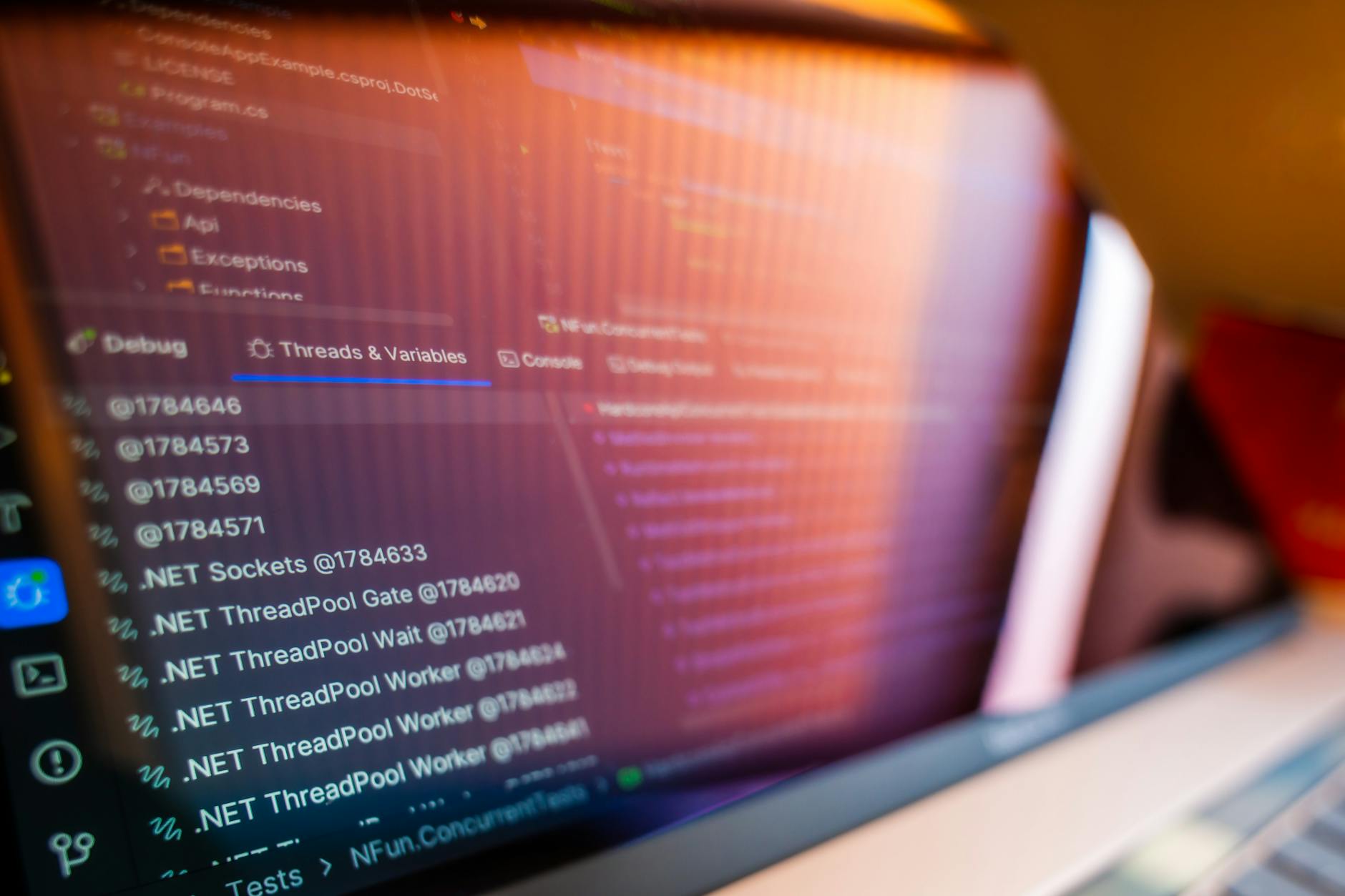 Python code displayed on computer screen showing Discord bot development environment