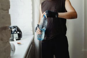 Modern water bottle on gym equipment with digital display