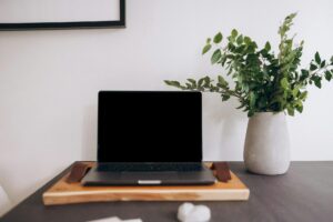 Modern laptop computer on organized desk workspace showing productivity setup
