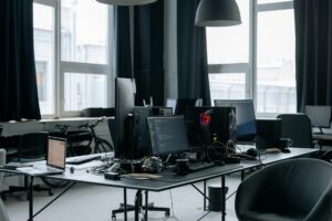 Modern office workspace with computer displaying Microsoft Office applications on screen