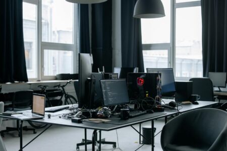 Modern office workspace with computer displaying Microsoft Office applications on screen