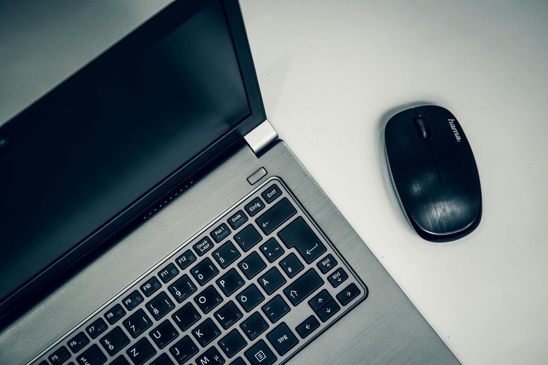 Modern laptop computer on clean desk workspace for creative professionals