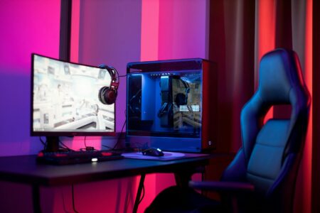 Modern computer setup with multiple monitors and streaming equipment for content creation