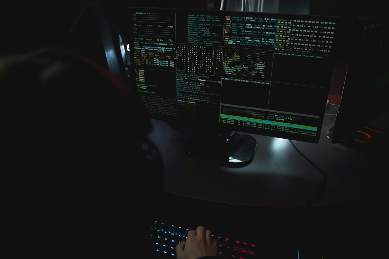 Computer monitor displaying 3D modeling software interface with complex geometric shapes