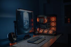 Multiple computer monitors arranged on a gaming desk setup