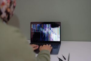 Close-up of laptop screen displaying code and AI interface for advanced ChatGPT features