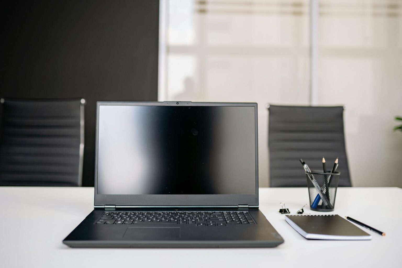 Modern laptop computer on office desk setup for remote work