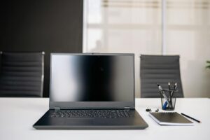 Modern laptop computer on office desk setup for remote work