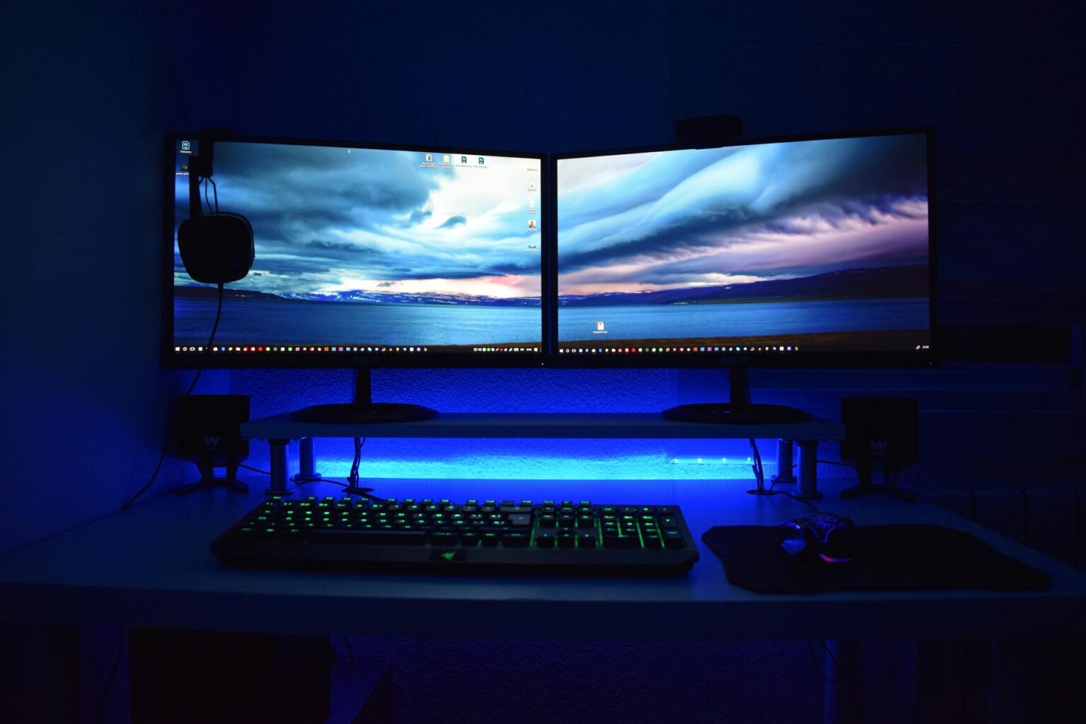 Modern computer workstation with dual monitors showing development environment setup