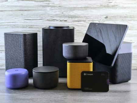 Family using smart speaker device in modern living room setting