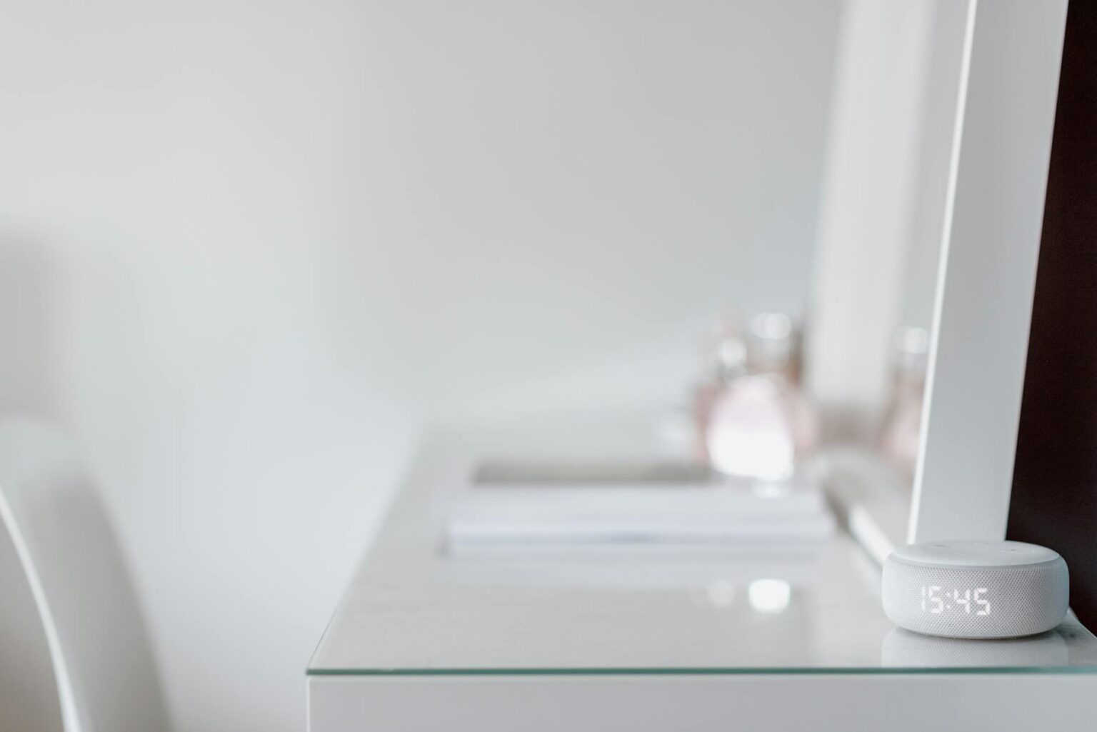 Modern smart mirror display showing fitness and weather information on sleek black screen
