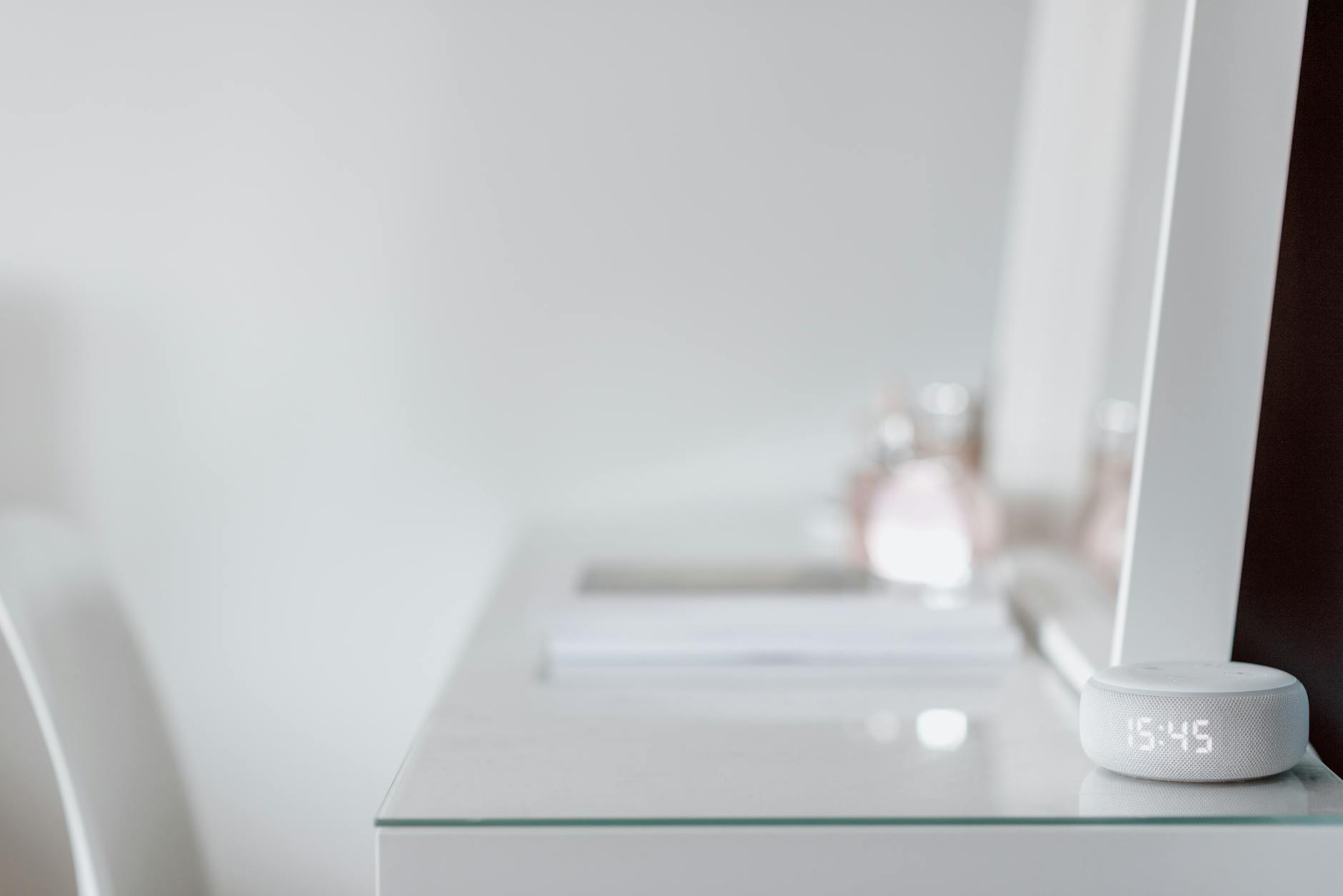 Modern smart mirror display showing fitness and weather information on sleek black screen