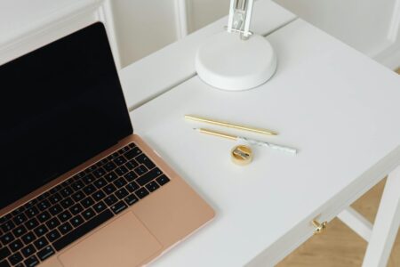 Modern laptop computer on clean desk setup representing student workspace