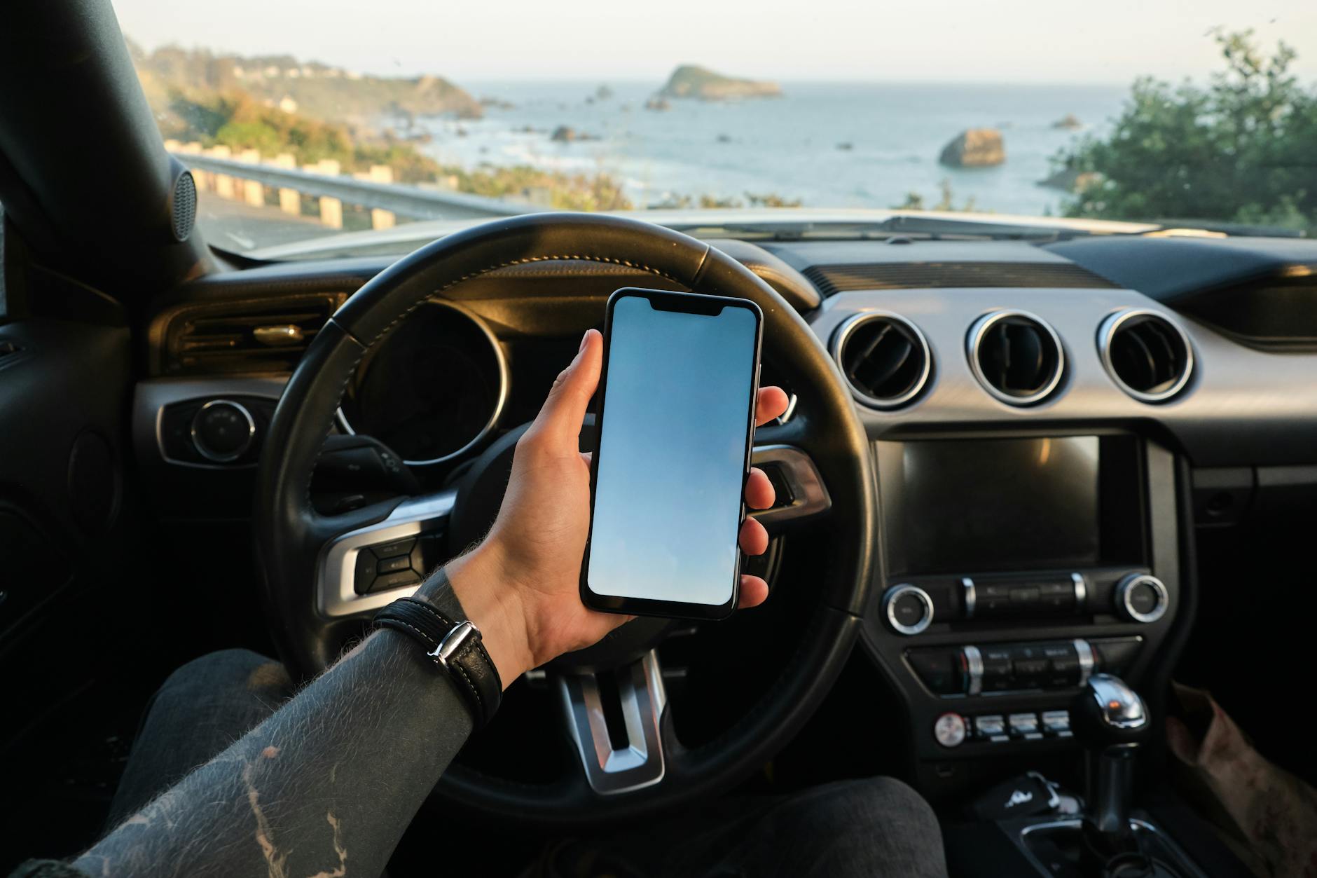 Smartphone mounted in car displaying diagnostic app interface