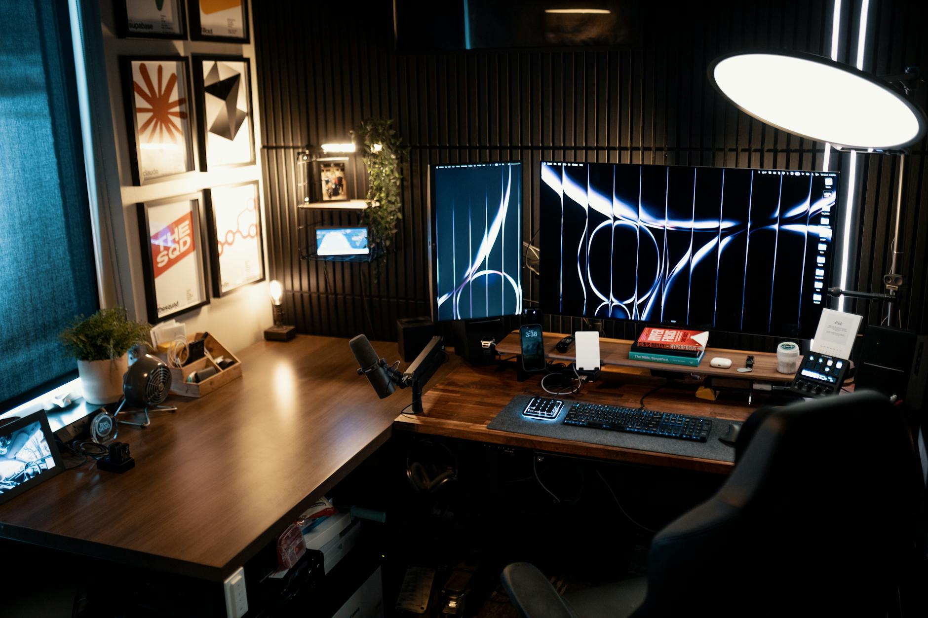 Clean, organized office desk with computer monitor showing multiple desktop environments