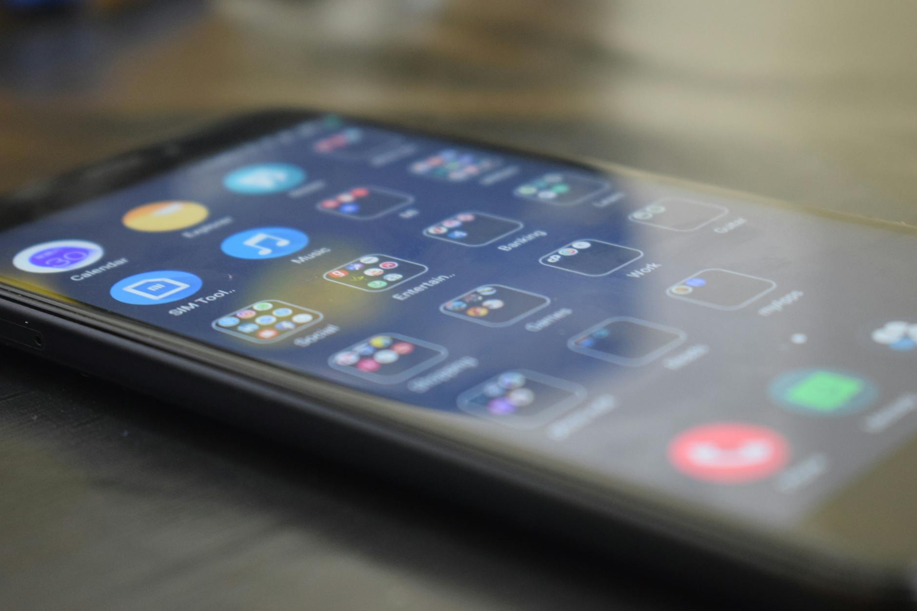 Person using smartphone app to control smart home lighting settings and automation