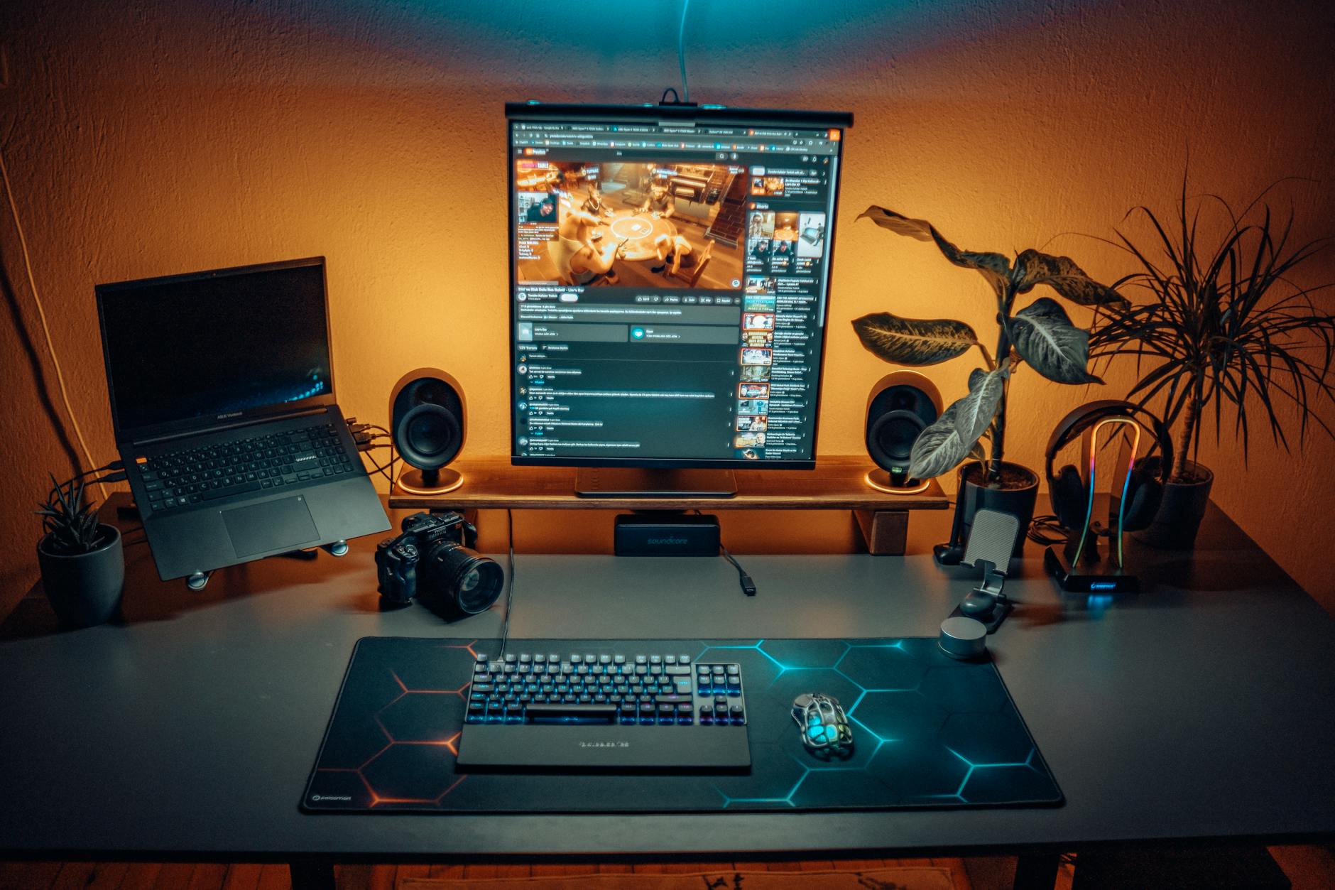 Clean minimalist desk setup with multiple electronic devices and charging accessories