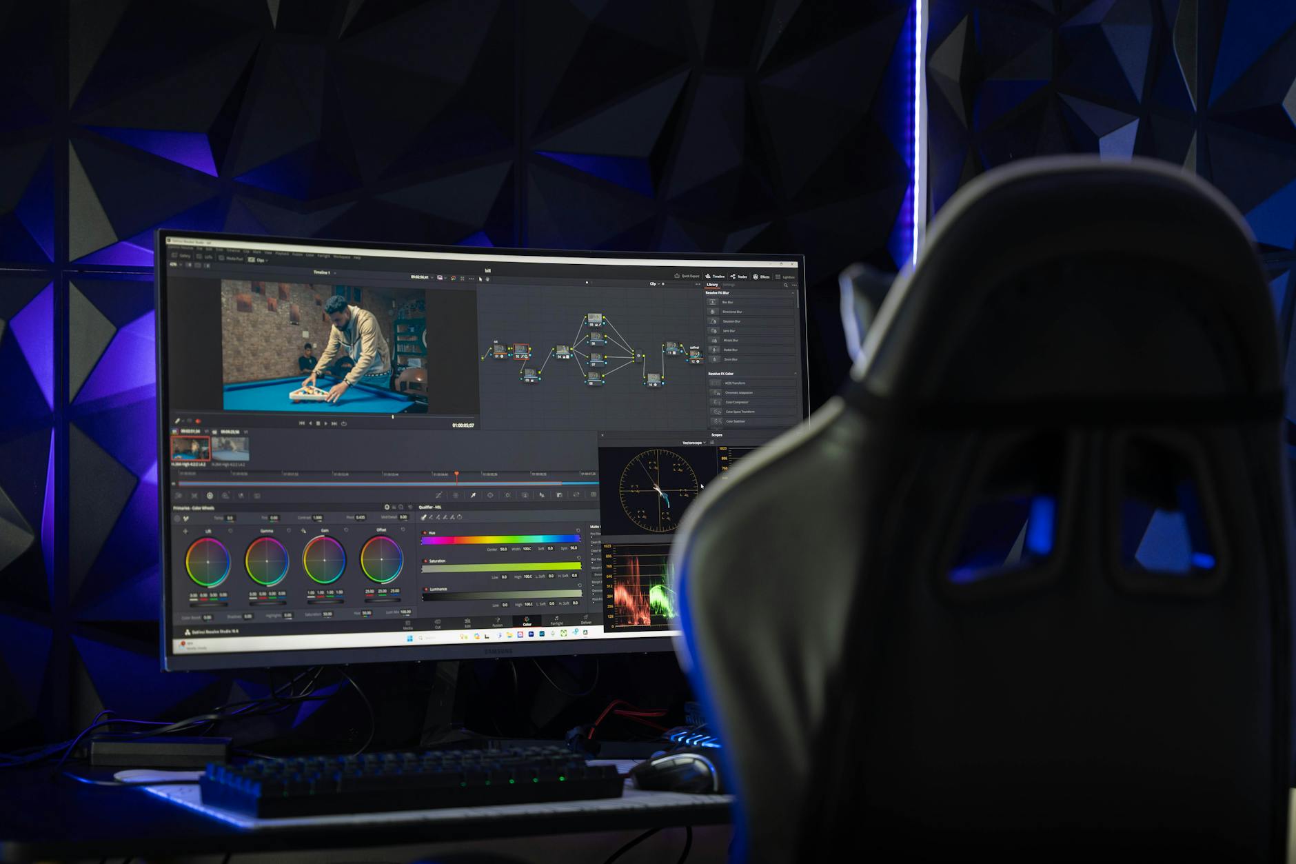 Professional video editing setup with multiple monitors displaying timeline and footage