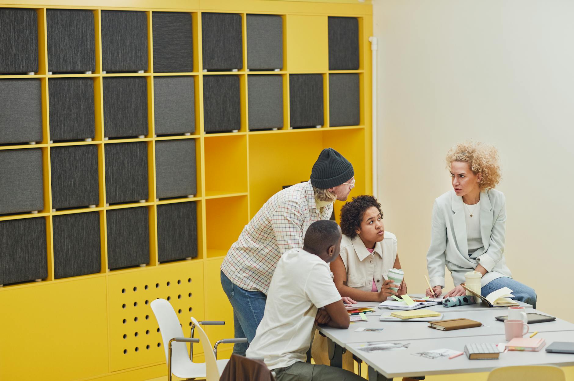 Professional team meeting in modern office discussing project collaboration