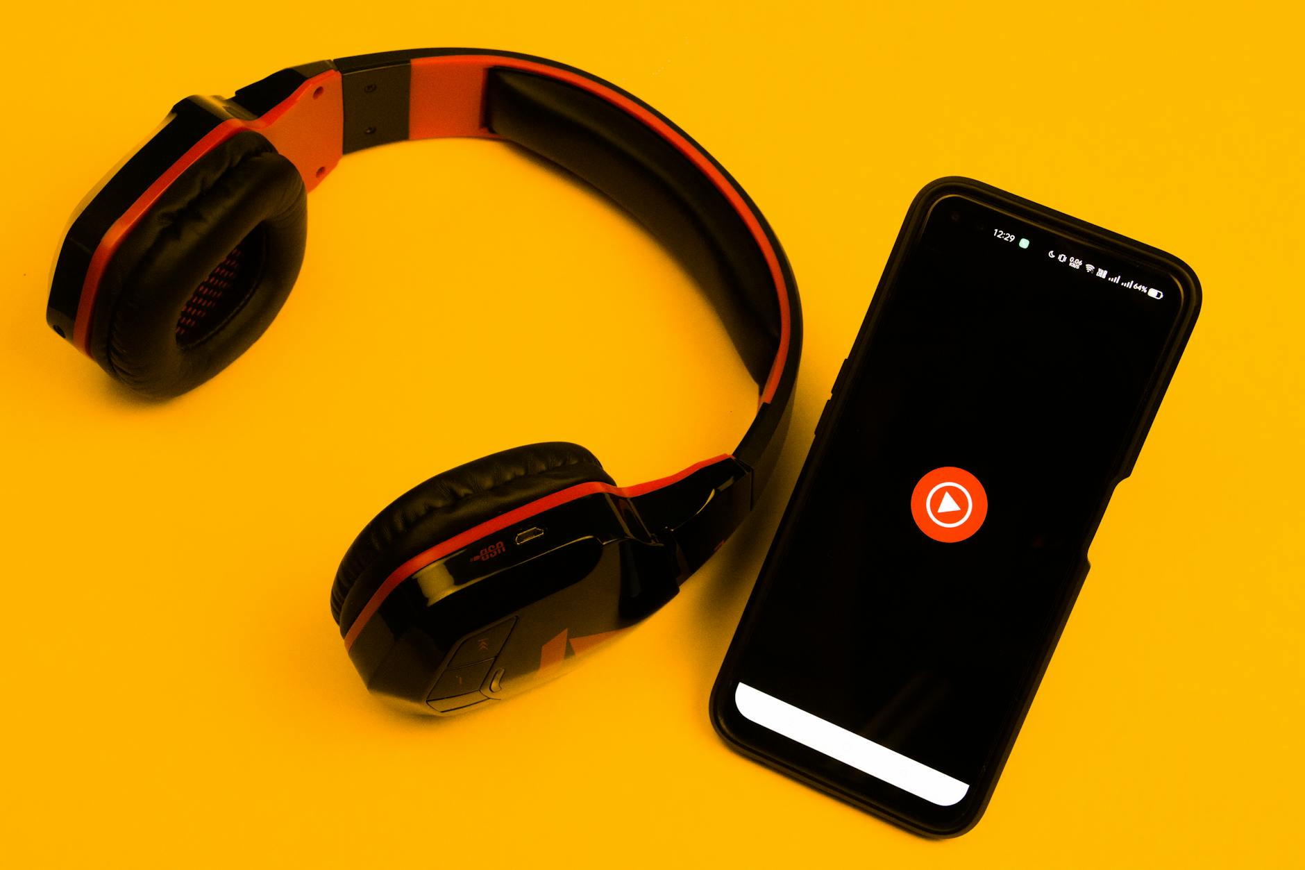 Person wearing wireless earbuds while listening to music
