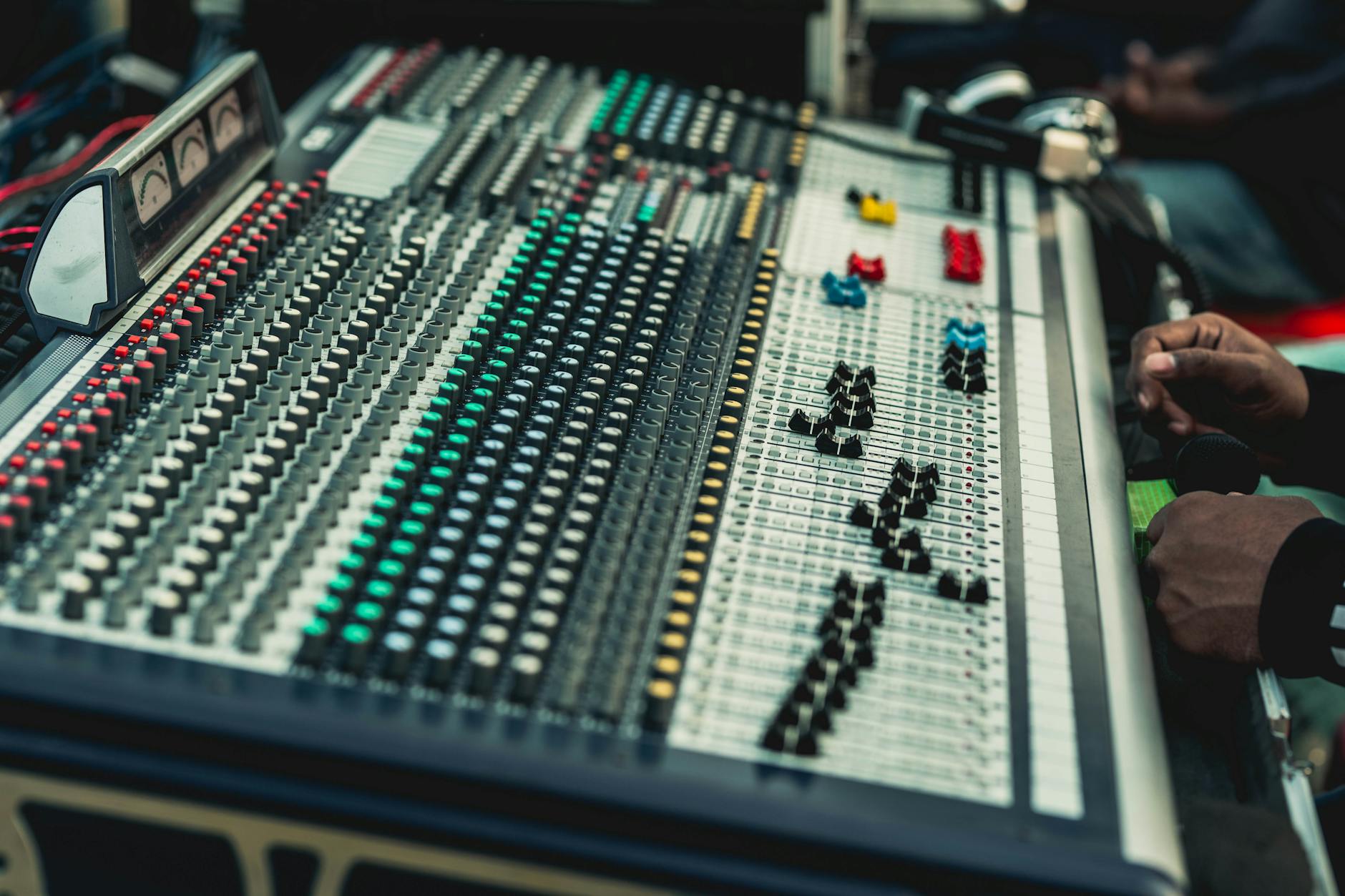 Digital audio mixing interface showing waveforms and level meters for sound mastering