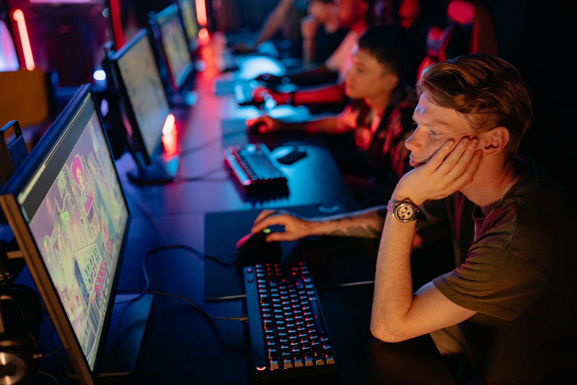 Competitive gaming tournament setup with multiple monitors and professional equipment