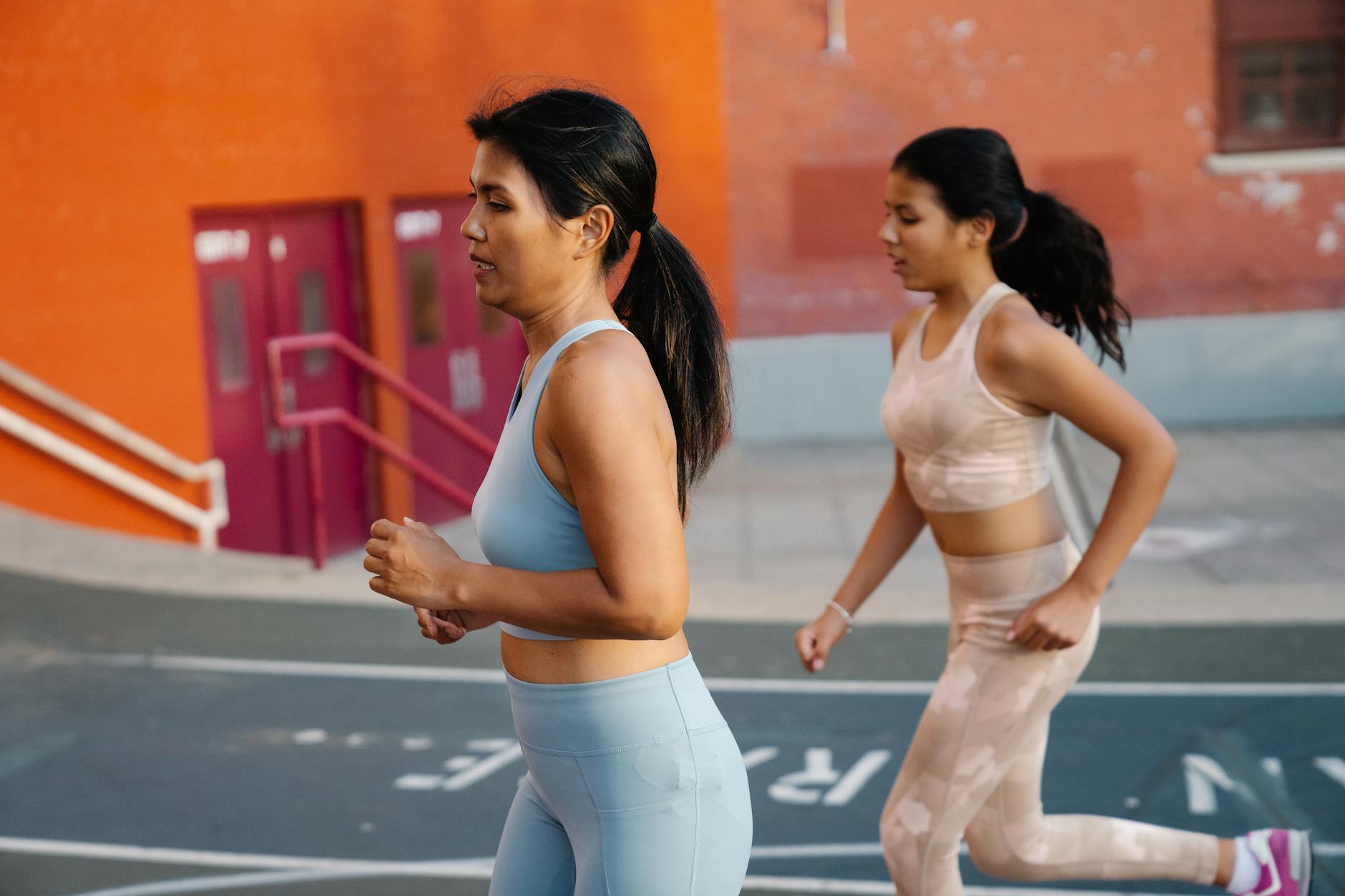 Runner checking smartwatch during outdoor training session