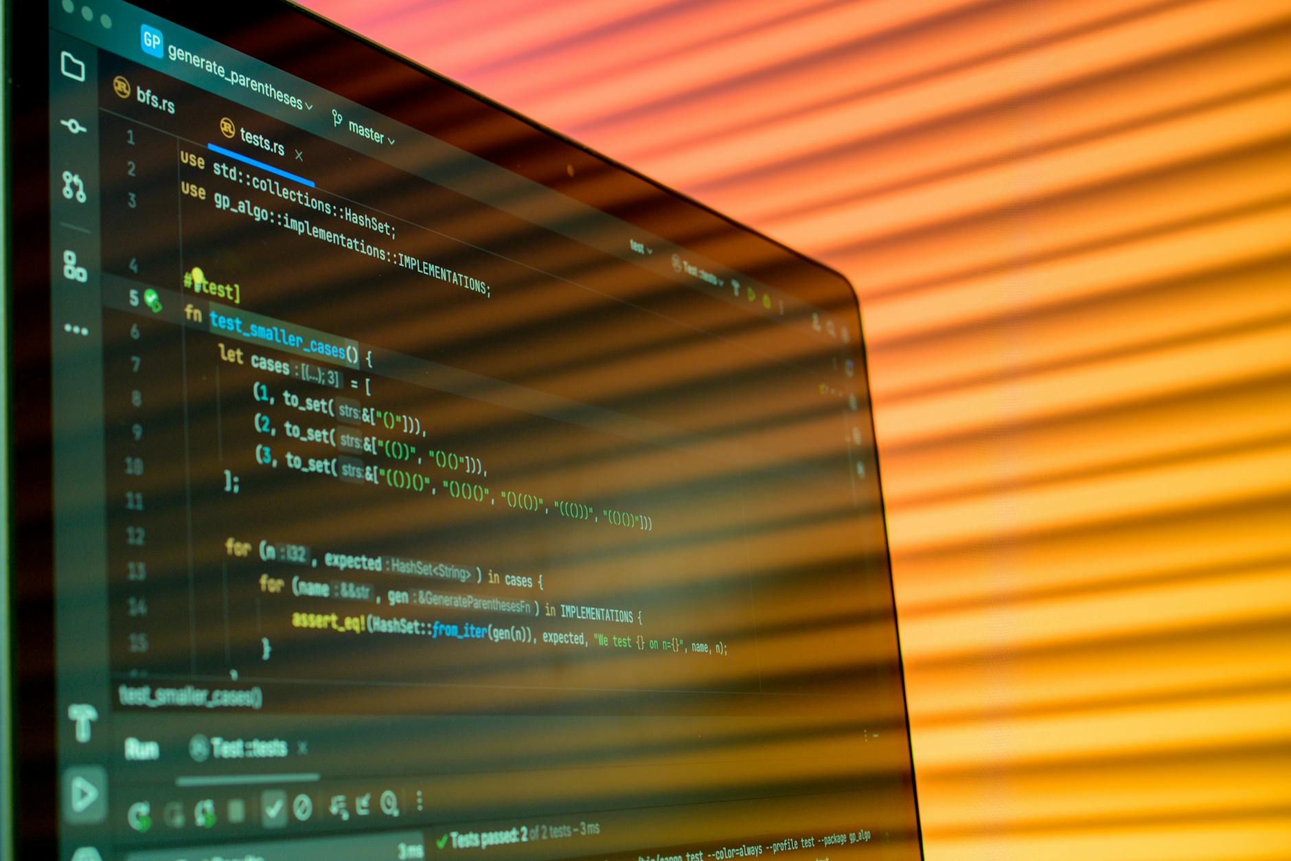 Developer working on code displayed on multiple monitors showing programming interface