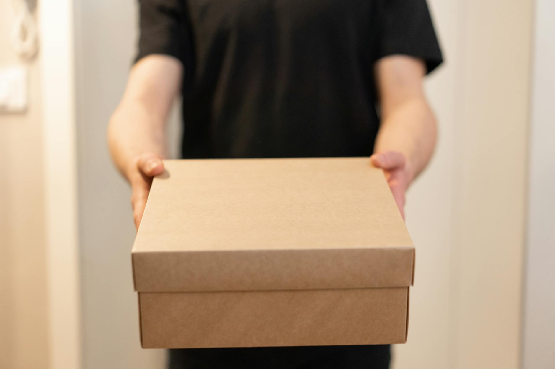 Delivery person placing package at front door