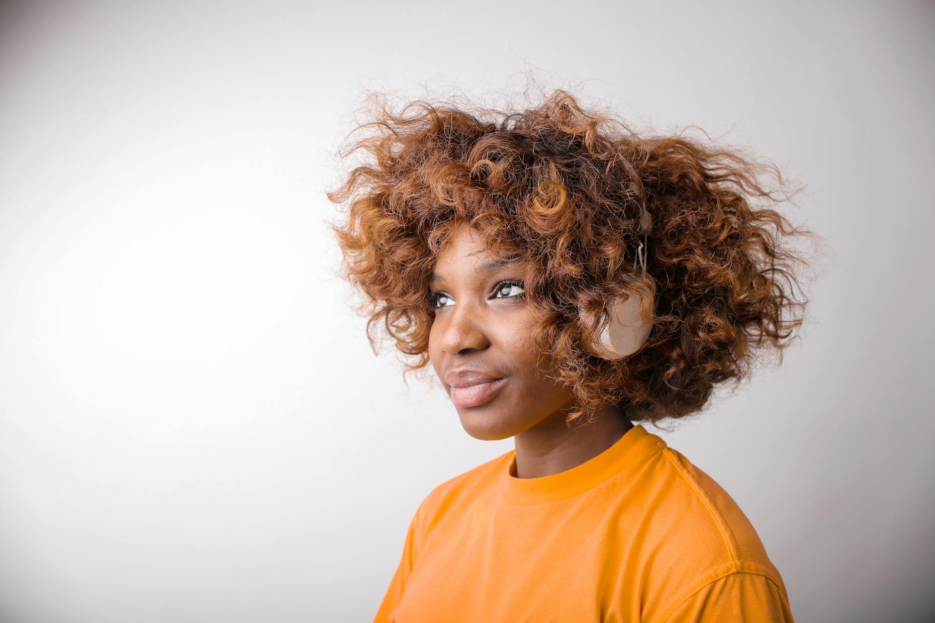 Person wearing over-ear headphones demonstrating comfort and fit for extended use