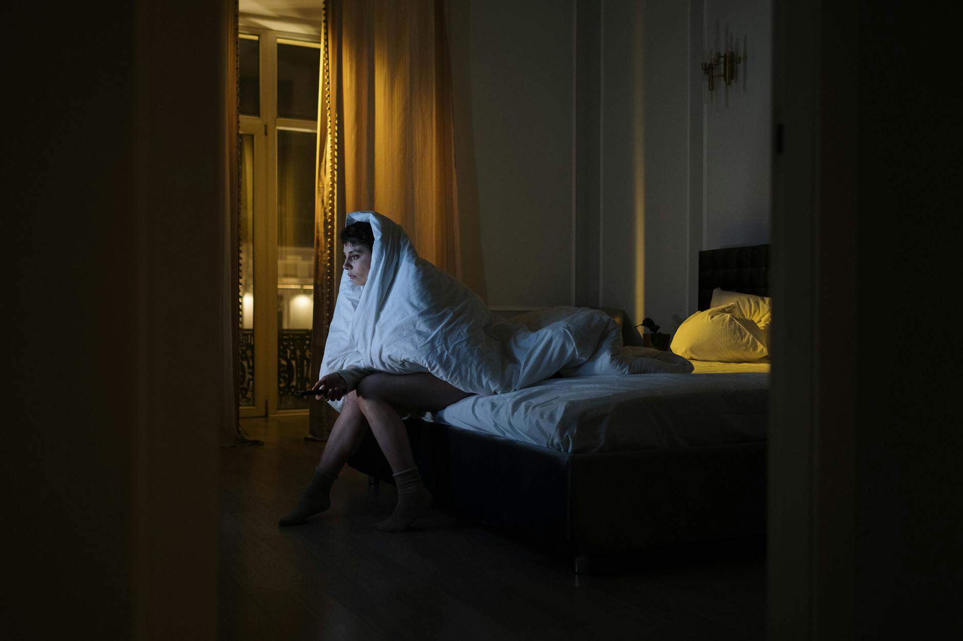 Warm ambient lighting in bedroom creating relaxing atmosphere for sleep
