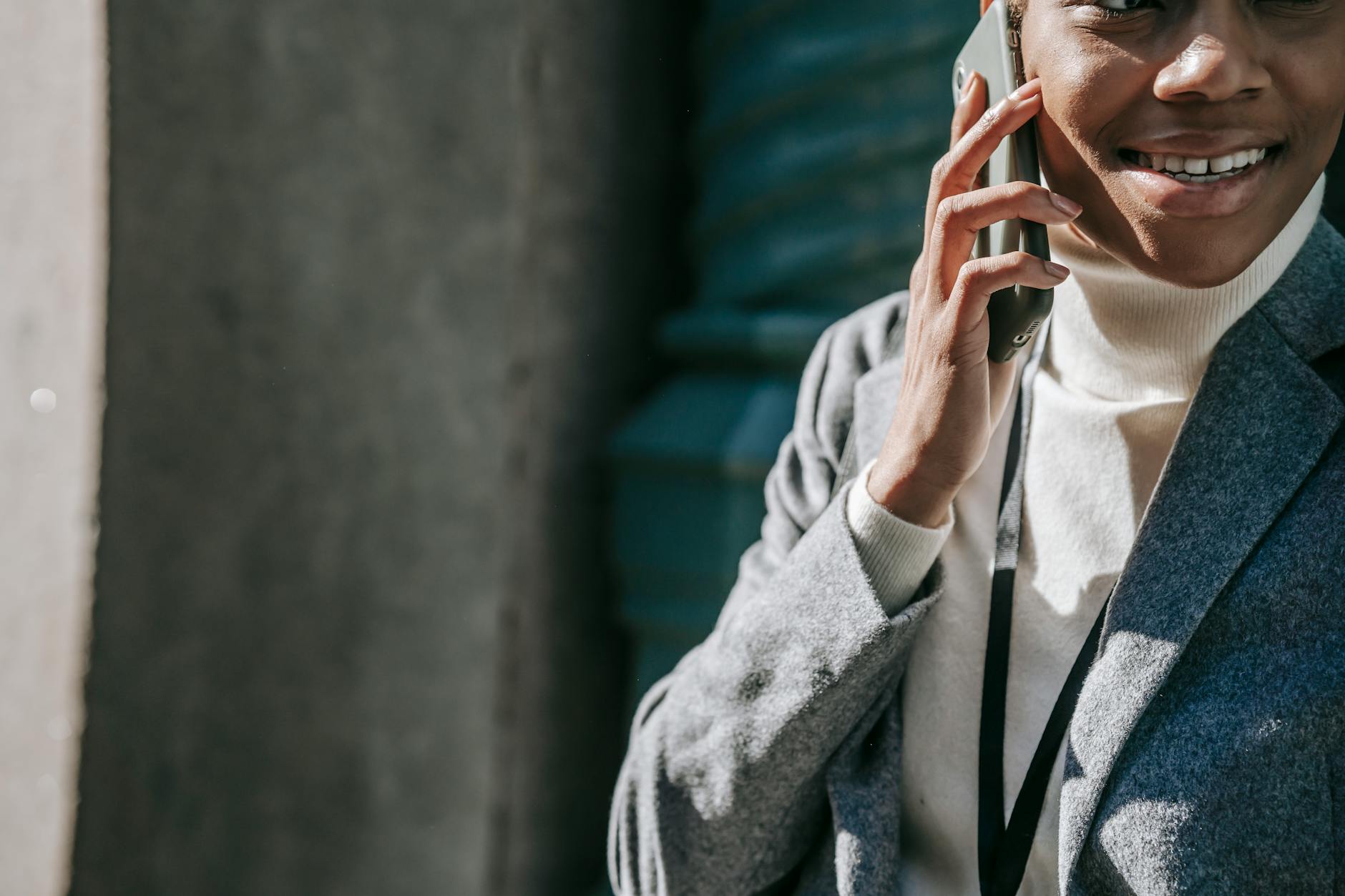Professional making phone call with wireless earbuds in office setting
