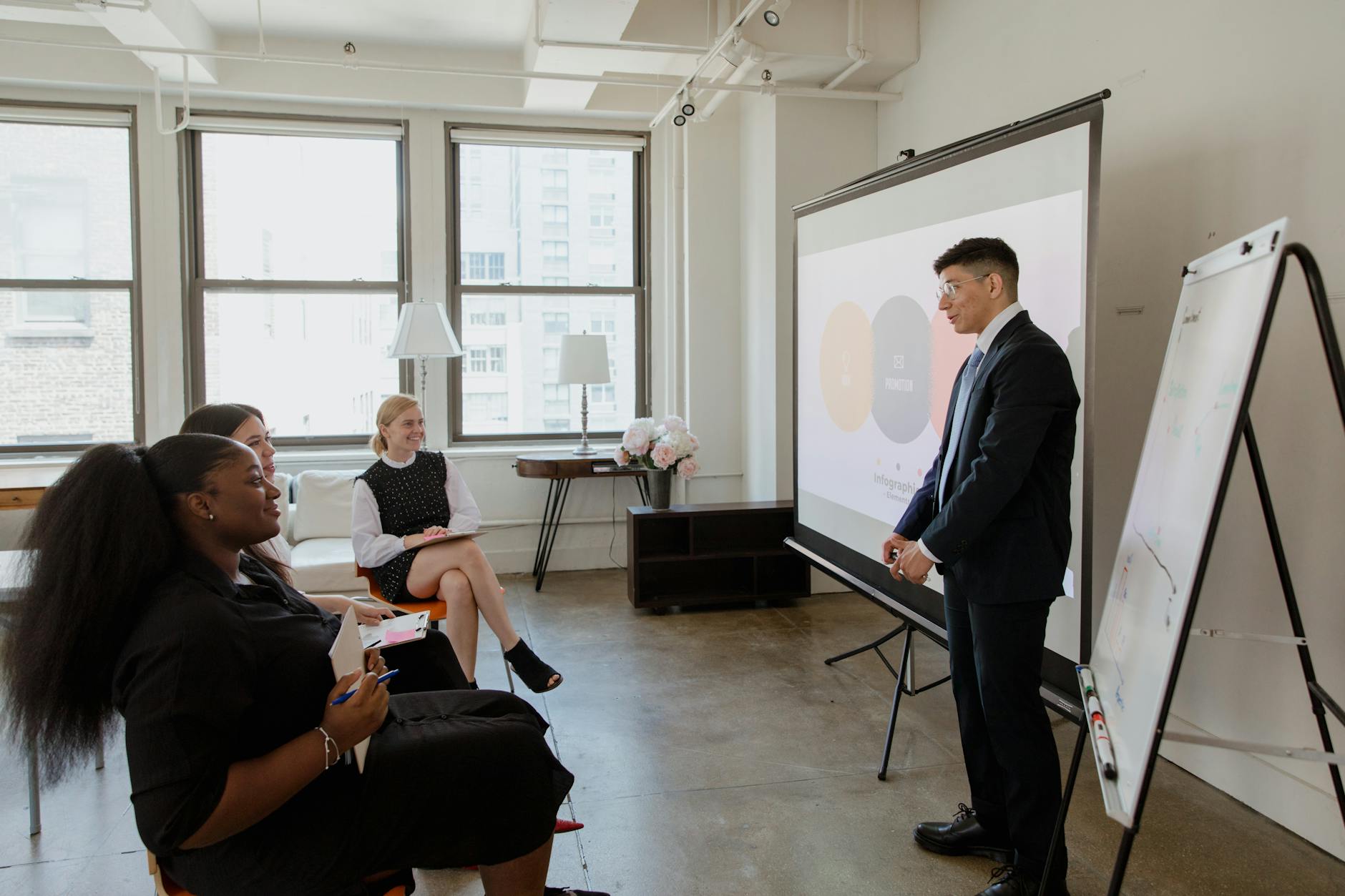 Professional team meeting with presentation screen showing business documents and charts