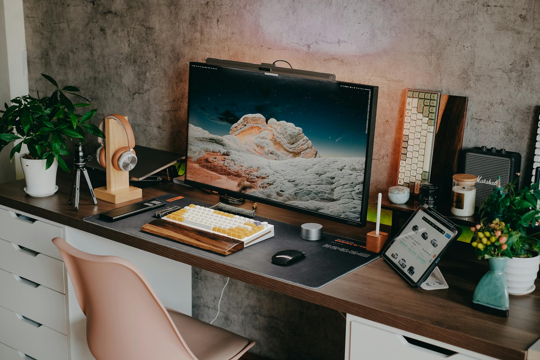 Professional office workspace with multiple monitors and creative tools