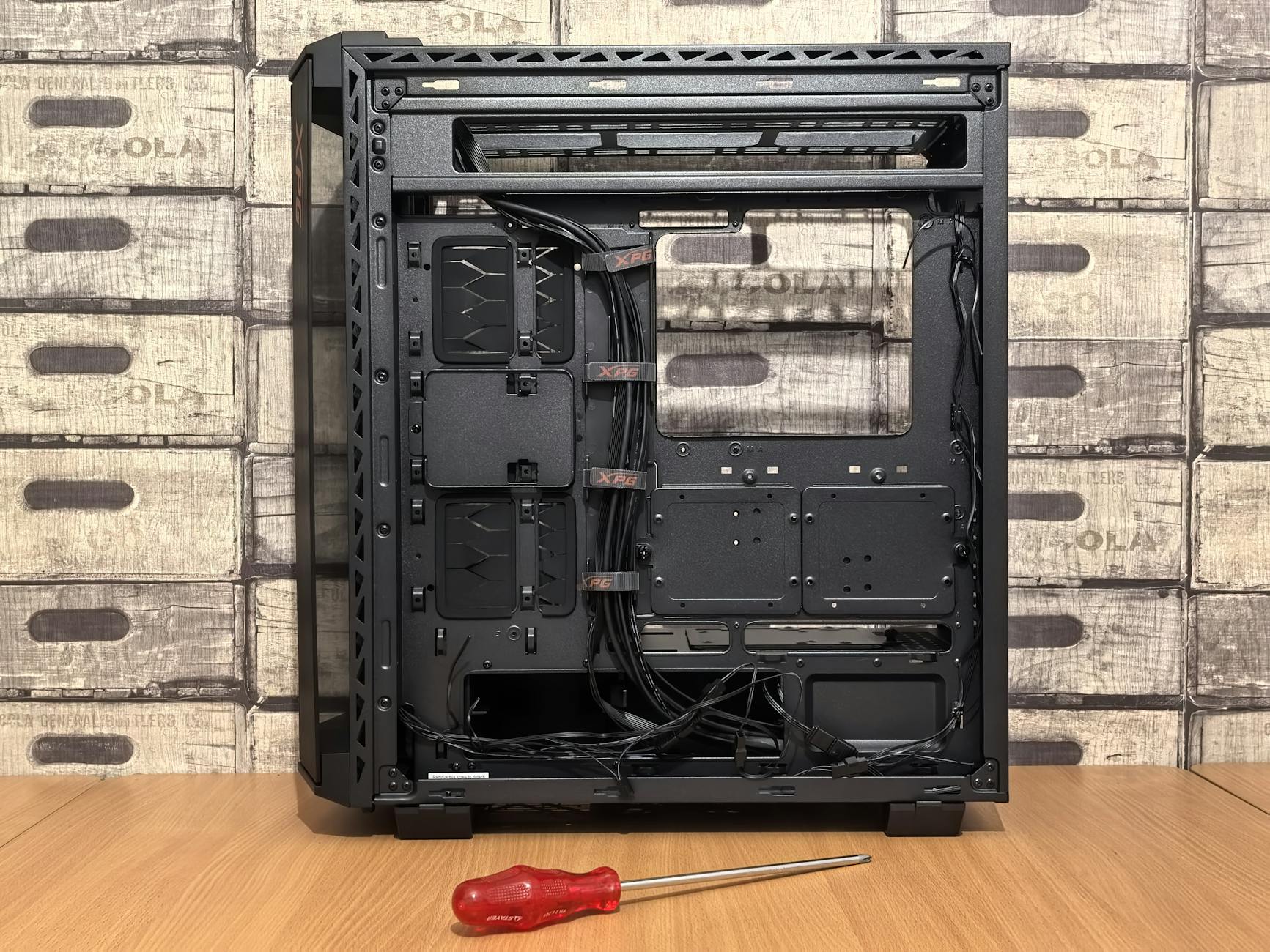 Essential PC building tools including screwdrivers and anti-static equipment arranged on a clean work surface