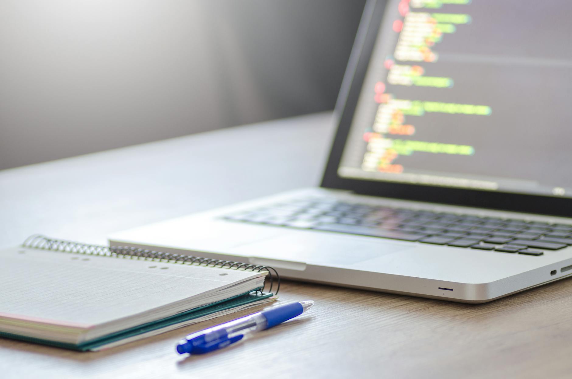 Clean web development workspace with multiple monitors showing WordPress admin dashboard and development tools