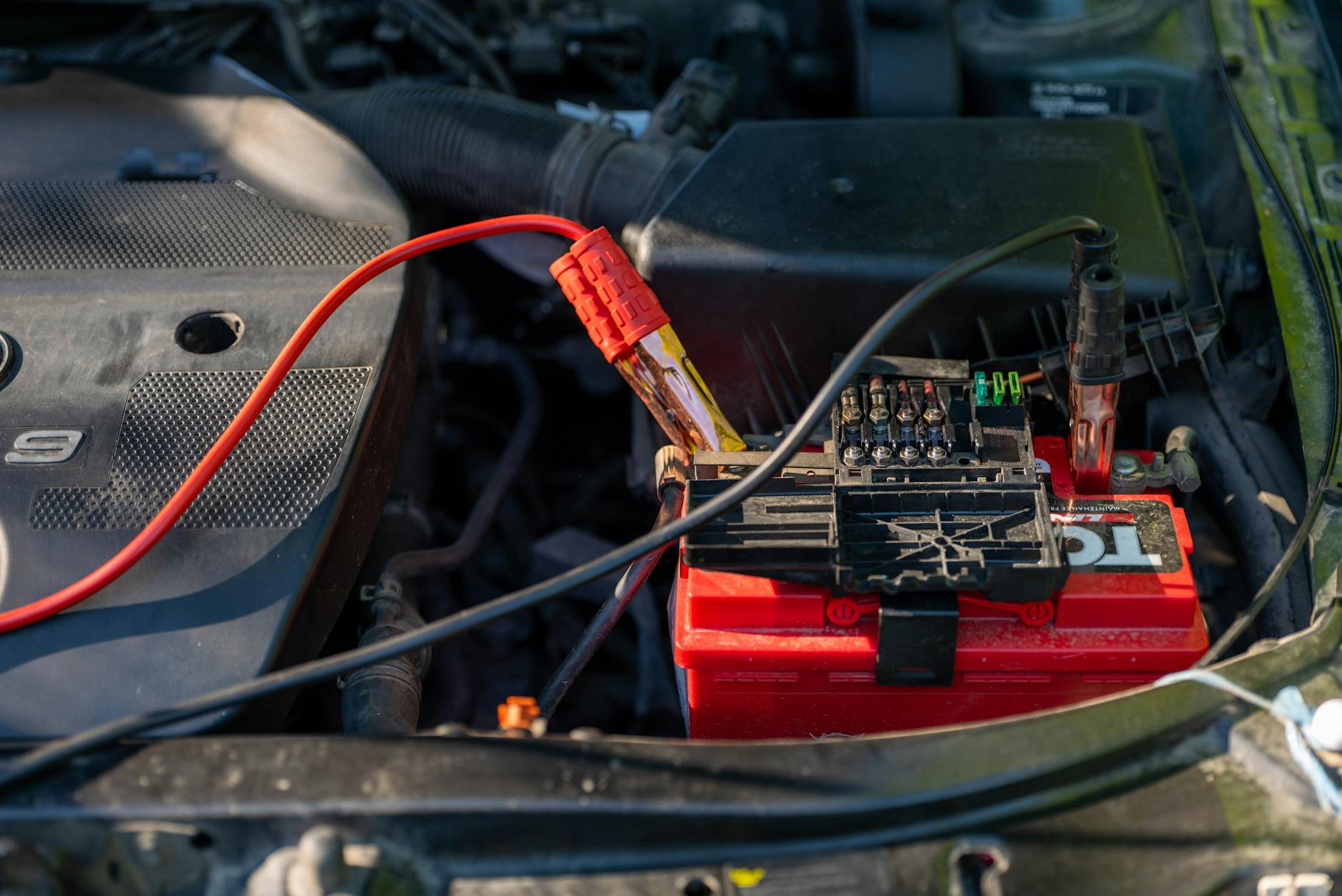 Close-up view of portable power station with charging cables and display