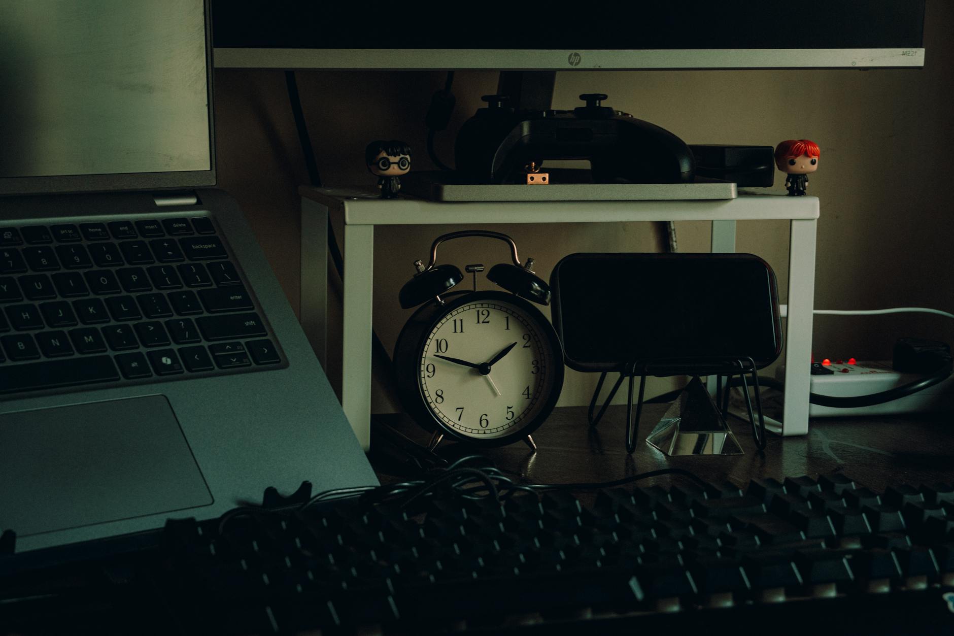 Organized modern office desk setup with multiple monitors and productivity tools