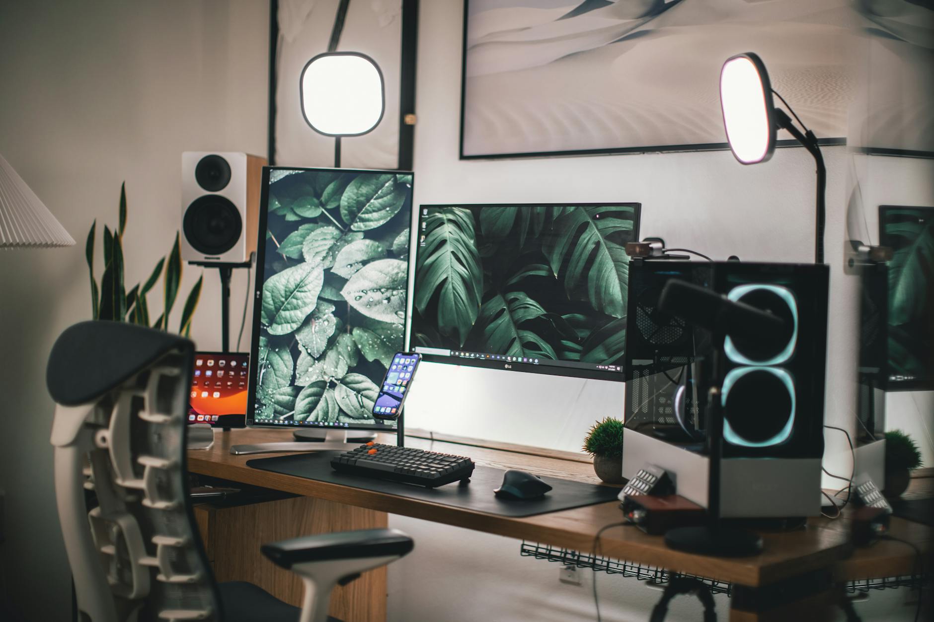 Content creator streaming setup with camera, microphone, and gaming chair at organized desk workspace