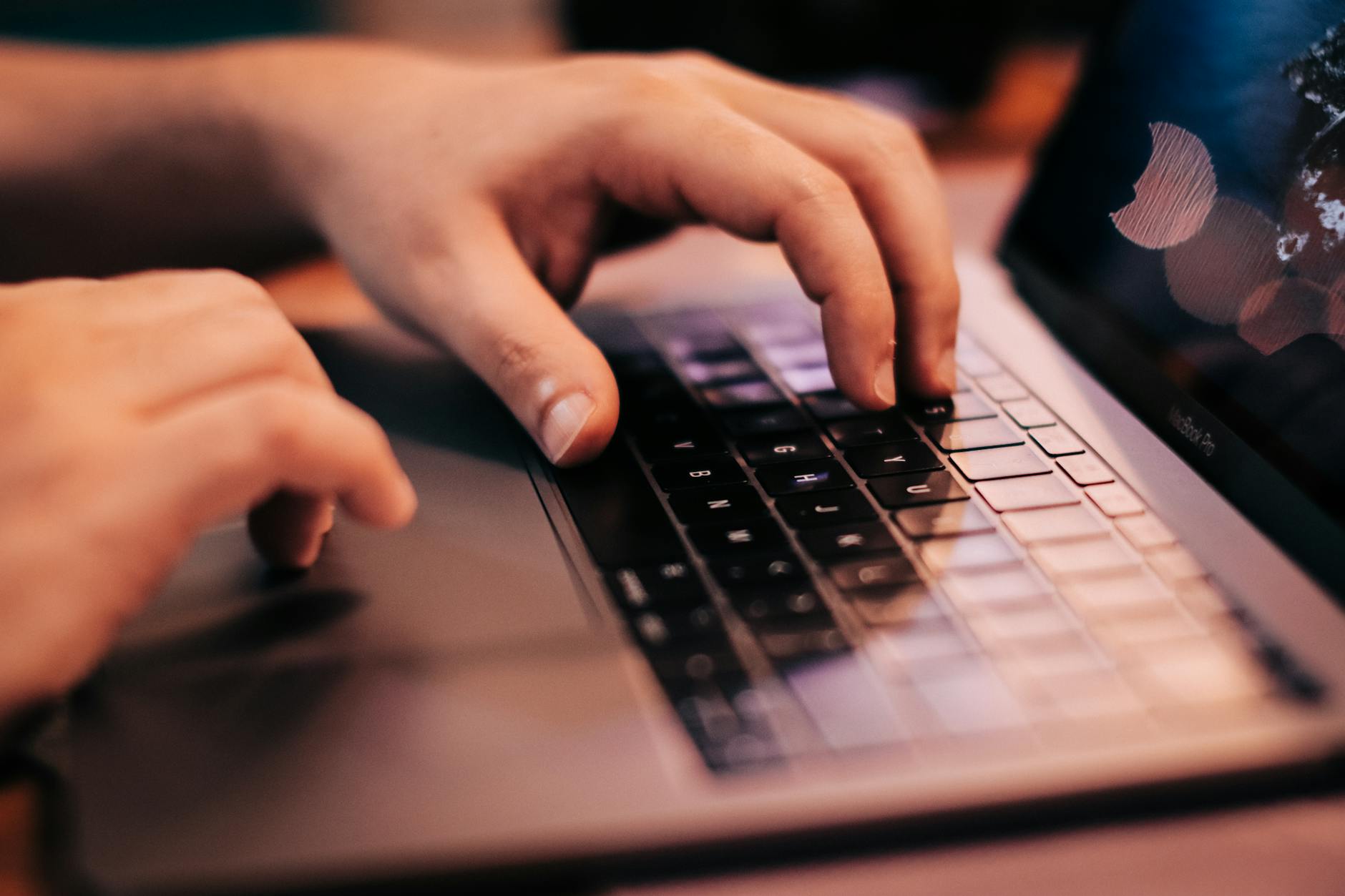 Hands typing on a customized mechanical keyboard demonstrating the final setup