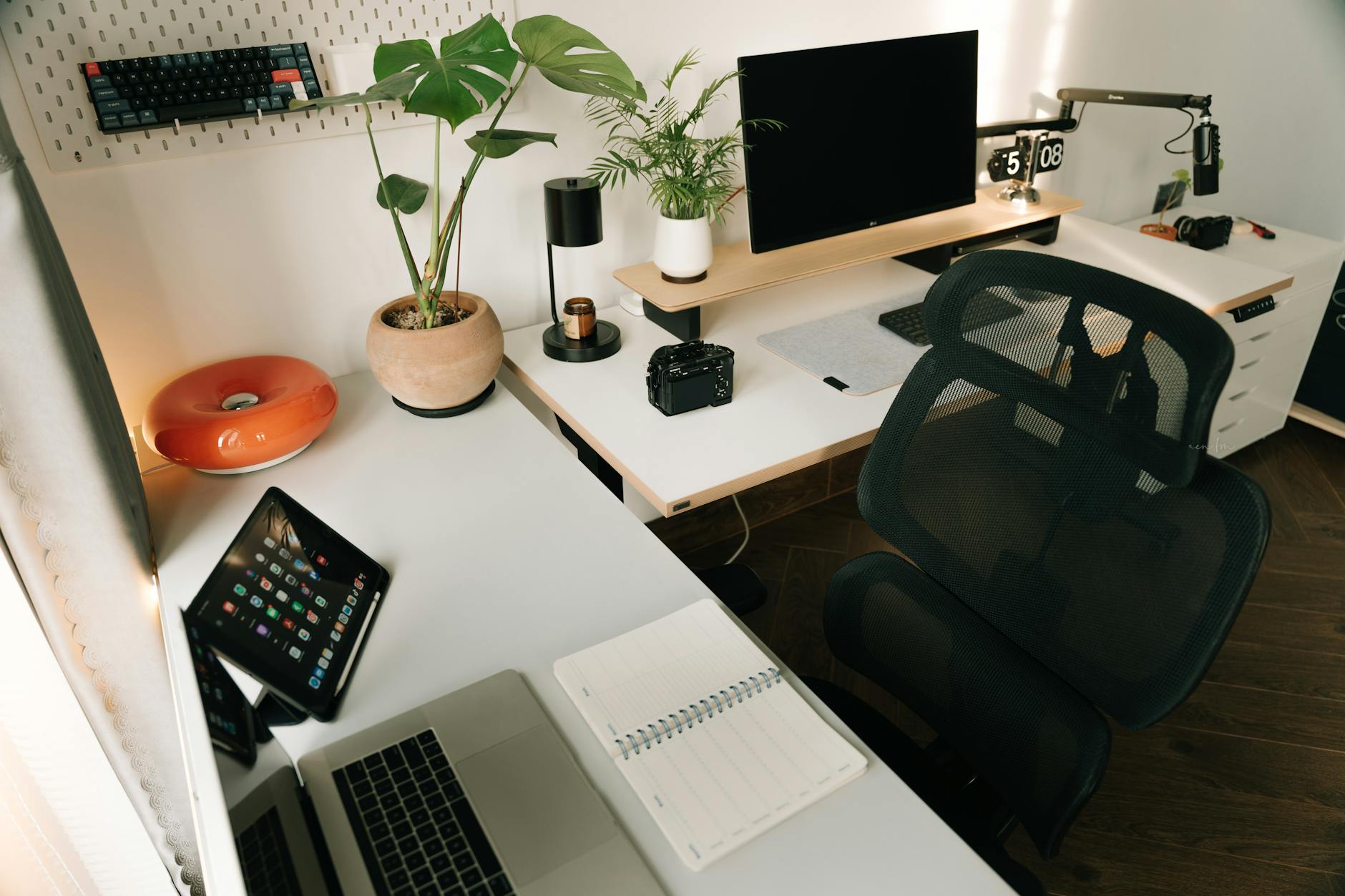 Modern home office setup with computer peripherals on a white desk