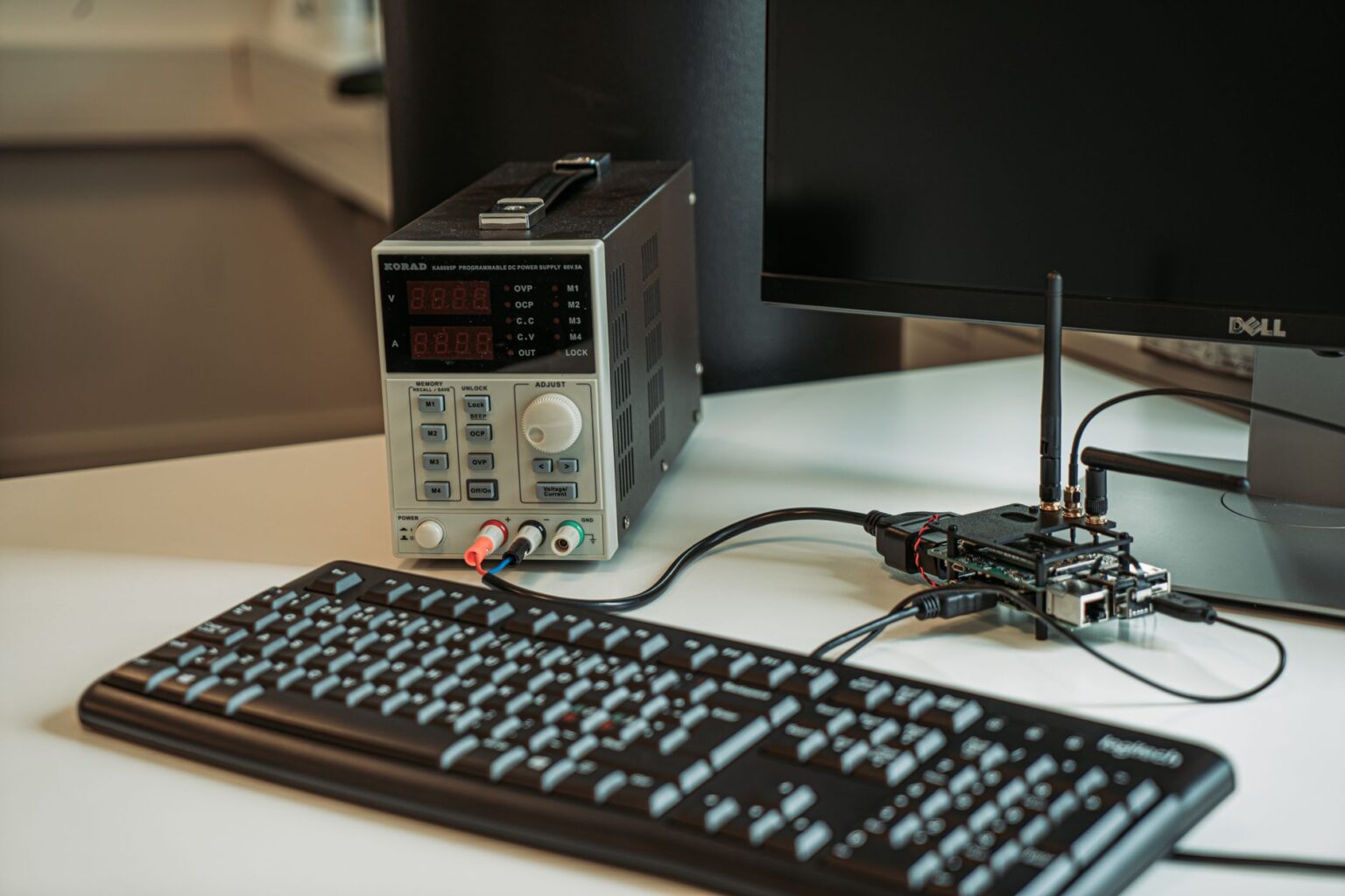 Raspberry Pi single-board computer connected to a keyboard and monitor on a desk